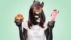 A composition graphic of a human figure with a horse head holding a hamburger and a milkshake