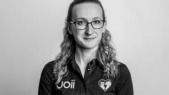 A black and white headshot of a Joii employee