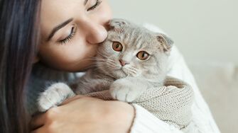 Lady cuddling a cat