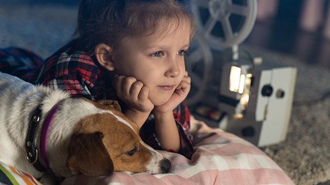 A movie marathon can be a good time for kids to snuggle with their pets